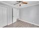 Spacious bedroom with double door closet and ceiling fan at 1142 Grayson Dr, Orlando, FL 32825