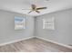 Spacious bedroom with ceiling fan and wood-look flooring at 1142 Grayson Dr, Orlando, FL 32825