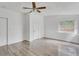 Bright bedroom with wood-look floors and ceiling fan at 1142 Grayson Dr, Orlando, FL 32825