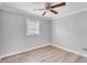 Bedroom with wood-look floors and ceiling fan at 1142 Grayson Dr, Orlando, FL 32825