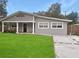Beautiful house with a well-maintained lawn and front porch at 1142 Grayson Dr, Orlando, FL 32825