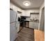 Renovated kitchen with white cabinets and stainless steel appliances at 1142 Grayson Dr, Orlando, FL 32825