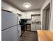 Renovated kitchen featuring modern white cabinets and stainless steel appliances at 1142 Grayson Dr, Orlando, FL 32825
