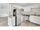 Modern kitchen with stainless steel appliances and white cabinets at 1142 Grayson Dr, Orlando, FL 32825