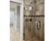 Updated bathroom with a walk-in shower and tiled floors at 12331 Warren Rd, Clermont, FL 34711