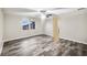 Bedroom with wood-look floors and ceiling fan at 12331 Warren Rd, Clermont, FL 34711
