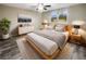 Spacious bedroom with light wood platform bed and large windows at 12331 Warren Rd, Clermont, FL 34711