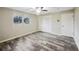 Bedroom with wood-look floors and ceiling fan at 12331 Warren Rd, Clermont, FL 34711