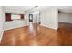 Spacious dining room with hardwood floors and kitchen view at 12331 Warren Rd, Clermont, FL 34711
