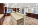 Modern kitchen boasting granite countertops, custom cabinetry, and a large island at 12331 Warren Rd, Clermont, FL 34711