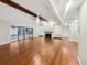 Spacious living room with hardwood floors and a fireplace at 12331 Warren Rd, Clermont, FL 34711