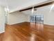 Spacious living area showcasing hardwood floors and sliding glass doors leading to the outdoors at 12331 Warren Rd, Clermont, FL 34711