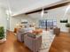 Bright living room with hardwood floors, vaulted ceiling, and access to patio at 12331 Warren Rd, Clermont, FL 34711