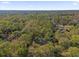 Aerial view of property showing home surrounded by lush forest at 126 Se 41St Ave, Ocala, FL 34471