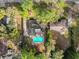 Bird's-eye view of home with pool, surrounded by trees at 126 Se 41St Ave, Ocala, FL 34471