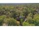 Aerial view showcasing a single-Gathering home nestled in a wooded area at 126 Se 41St Ave, Ocala, FL 34471