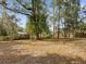 Spacious backyard with mature trees providing ample shade and privacy at 126 Se 41St Ave, Ocala, FL 34471
