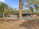 Relaxing backyard oasis featuring a refreshing pool, lush landscaping, and a hammock at 126 Se 41St Ave, Ocala, FL 34471