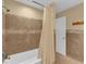 Clean bathroom with shower/tub combo and tile flooring at 126 Se 41St Ave, Ocala, FL 34471
