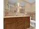 Double vanity bathroom with wood cabinets and oval mirrors at 126 Se 41St Ave, Ocala, FL 34471