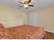 Bedroom with double bed, ceiling fan and double door closet at 126 Se 41St Ave, Ocala, FL 34471