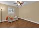 Bedroom with couch and ceiling fan at 126 Se 41St Ave, Ocala, FL 34471
