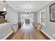 Dining room with hardwood floors, large table, and chandelier at 126 Se 41St Ave, Ocala, FL 34471