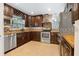 Modern kitchen featuring dark wood cabinets and stainless steel appliances at 126 Se 41St Ave, Ocala, FL 34471