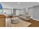 Living room with hardwood floors, comfortable seating, and ample natural light at 126 Se 41St Ave, Ocala, FL 34471
