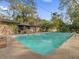 Relaxing pool with patio and string lights at 126 Se 41St Ave, Ocala, FL 34471