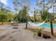 Inviting pool with wooden hammock at 126 Se 41St Ave, Ocala, FL 34471