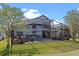 Enjoy the screened-in backyard patio complete with outdoor furniture and a view of the lush lawn at 127 Westmoreland Cir, Kissimmee, FL 34744
