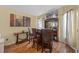Cozy bar area with three leather chairs, a TV, and wood floors at 127 Westmoreland Cir, Kissimmee, FL 34744