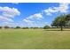 View of the surrounding green golf course at 127 Westmoreland Cir, Kissimmee, FL 34744