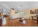 Bright living space featuring vaulted ceilings, wood floors, and lots of comfortable seating at 127 Westmoreland Cir, Kissimmee, FL 34744