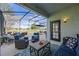 Outdoor patio with lounge seating area overlooking a golf course at 127 Westmoreland Cir, Kissimmee, FL 34744