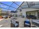 Outdoor living with multiple lounge seating and dining areas, with a view of the patio and pool at 127 Westmoreland Cir, Kissimmee, FL 34744