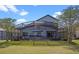 A spacious screened-in patio is perfect for outdoor gatherings with plenty of seating at 127 Westmoreland Cir, Kissimmee, FL 34744