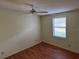 Well-lit bedroom with wood flooring and window coverings at 1311 E Schwartz E Blvd, Lady Lake, FL 32159