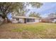 This single-story home has a pleasant backyard and screened-in patio with lots of room for leisure at 1335 Lescot Ln, Orlando, FL 32811