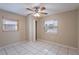 Comfortable bedroom featuring two windows and a closet for storage at 1335 Lescot Ln, Orlando, FL 32811