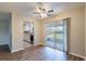 Cozy dining room with hardwood floors, ceiling fan, and sliding glass doors adjacent to an updated kitchen at 1335 Lescot Ln, Orlando, FL 32811