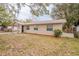 Inviting single-story home with a covered entry and well-maintained lawn, offering great curb appeal at 1335 Lescot Ln, Orlando, FL 32811