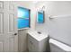 Simple bathroom with a vanity and window at 1375 Sacramento St, Deltona, FL 32725