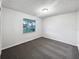 Simple bedroom with neutral walls and grey carpet at 1375 Sacramento St, Deltona, FL 32725