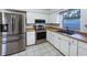 Modern kitchen with stainless steel appliances and light wood countertops at 1375 Sacramento St, Deltona, FL 32725