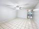 Spacious living room with tile flooring and access to backyard at 1375 Sacramento St, Deltona, FL 32725