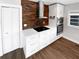 Stylish kitchen boasting a wood-look backsplash and updated cabinetry at 14421 Parker Rd, Orlando, FL 32832
