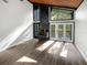 Bright living room featuring hardwood floors and a stone fireplace at 14421 Parker Rd, Orlando, FL 32832