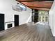 Spacious living area featuring a fireplace and large windows at 14421 Parker Rd, Orlando, FL 32832
